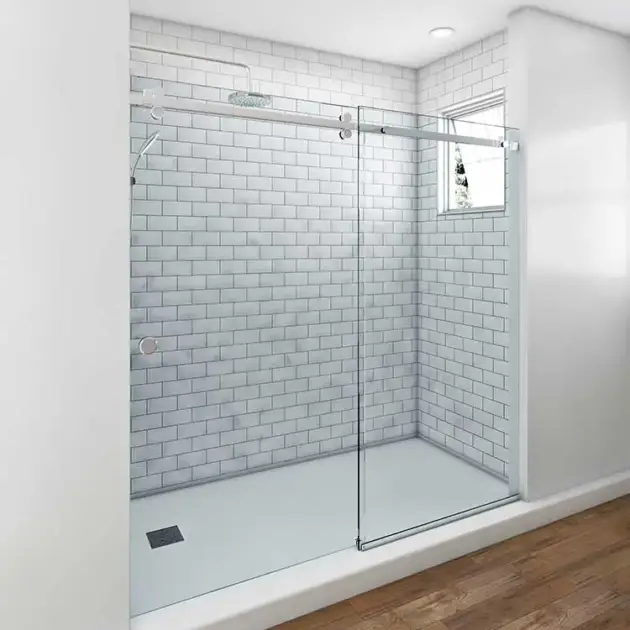 CELESTIAL sliding shower door with chrome hardware and clear glass panels in a modern bathroom with subway tile walls.