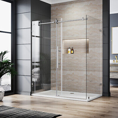 Custom frameless shower door with clear glass panels and chrome hardware in a modern bathroom with beige tile walls.