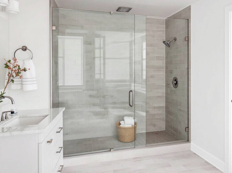 Custom frameless shower enclosure installation in a modern contemporary design, Waltham, MA.